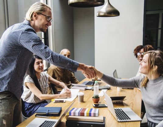 Business people shaking hands in agreement